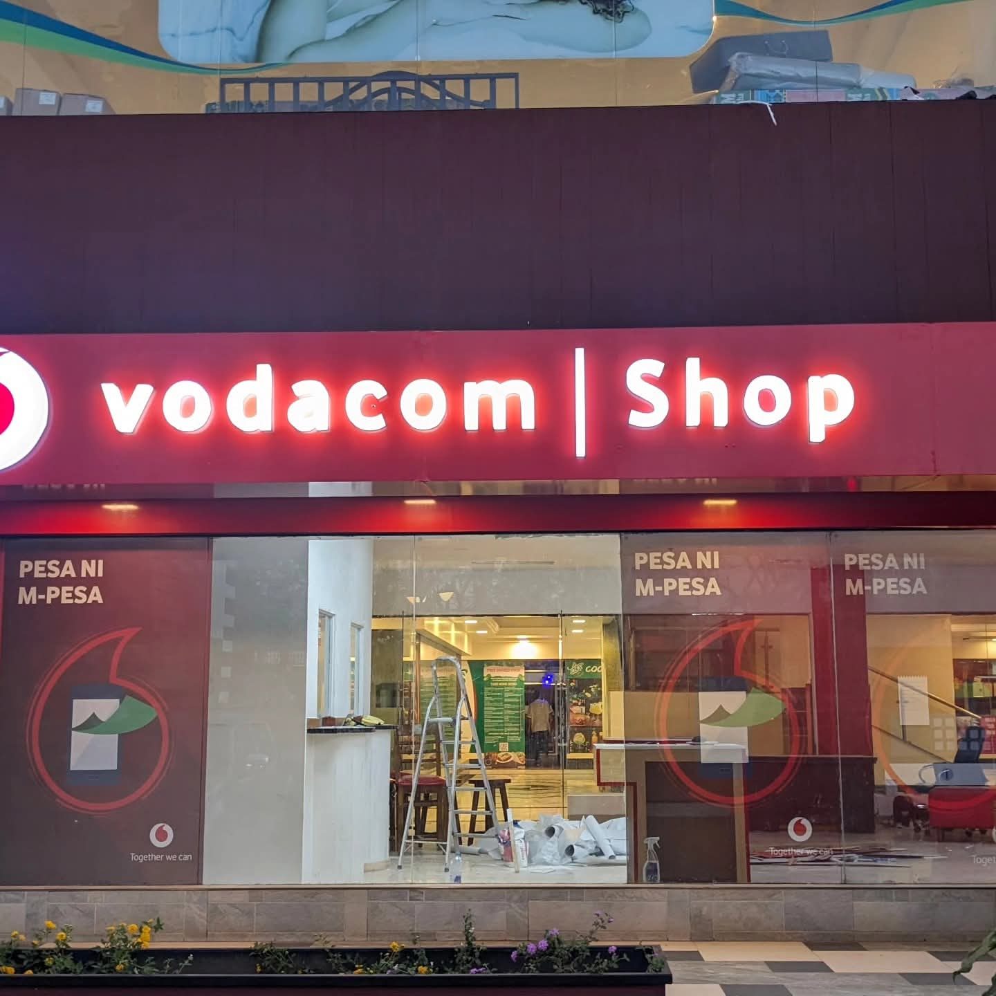 Illuminated Vodacom Shop signage at night by Gravimark